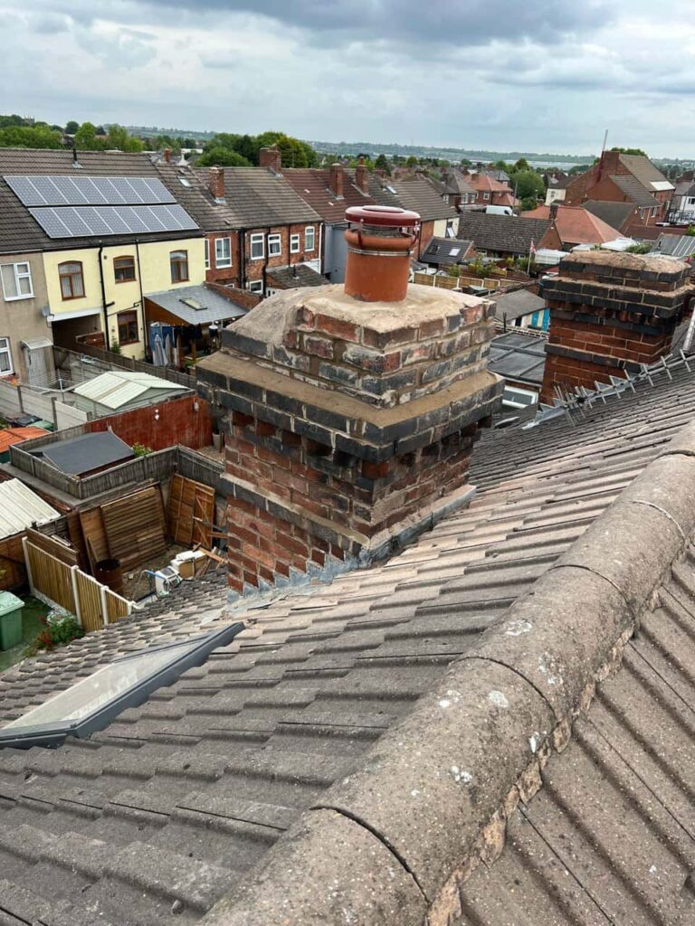 This is a photo taken from a roof which is being repaired by Brandon Roofing Repairs, it shows a street of houses, and their roofs